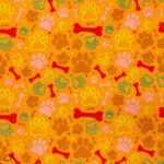 115CM PRINTED POLY COTTON ORANGE BONES AND PAWS - Image 2